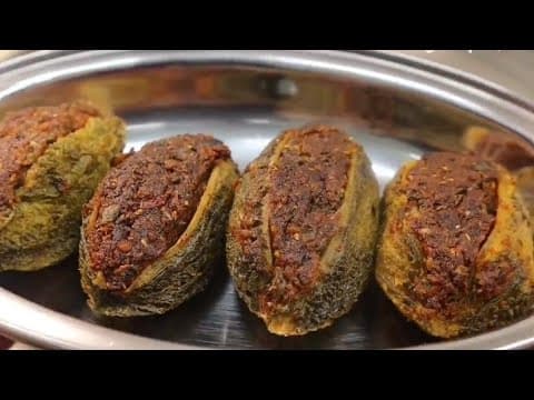 Stuffed Bitter Gourd (Karela) with Spicy Masala - Indian recipe that serves 4 people. A medium difficulty cooking recipe converted from YouTube video with complete ingredients and step-by-step instructions.