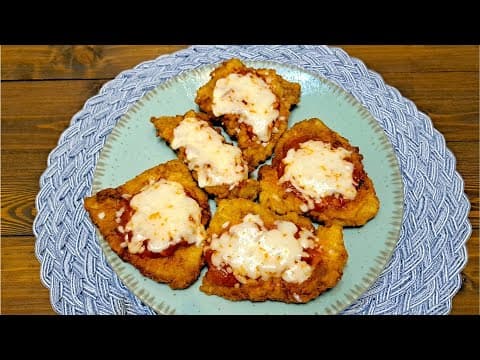 Schnitzel with a delicious thick tomato sauce and melted mozzarella cheese.