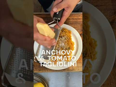Tagliolini with anchovies, fresh tomatoes, basil, and garlic