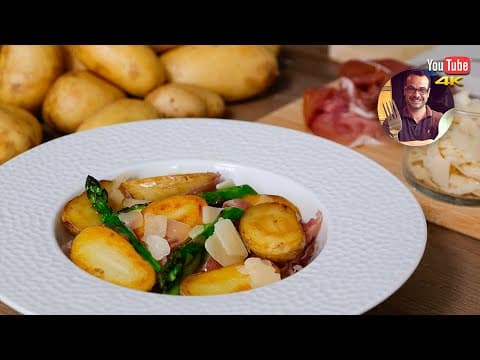 Fresh new potato salad with asparagus, raw ham and parmesan